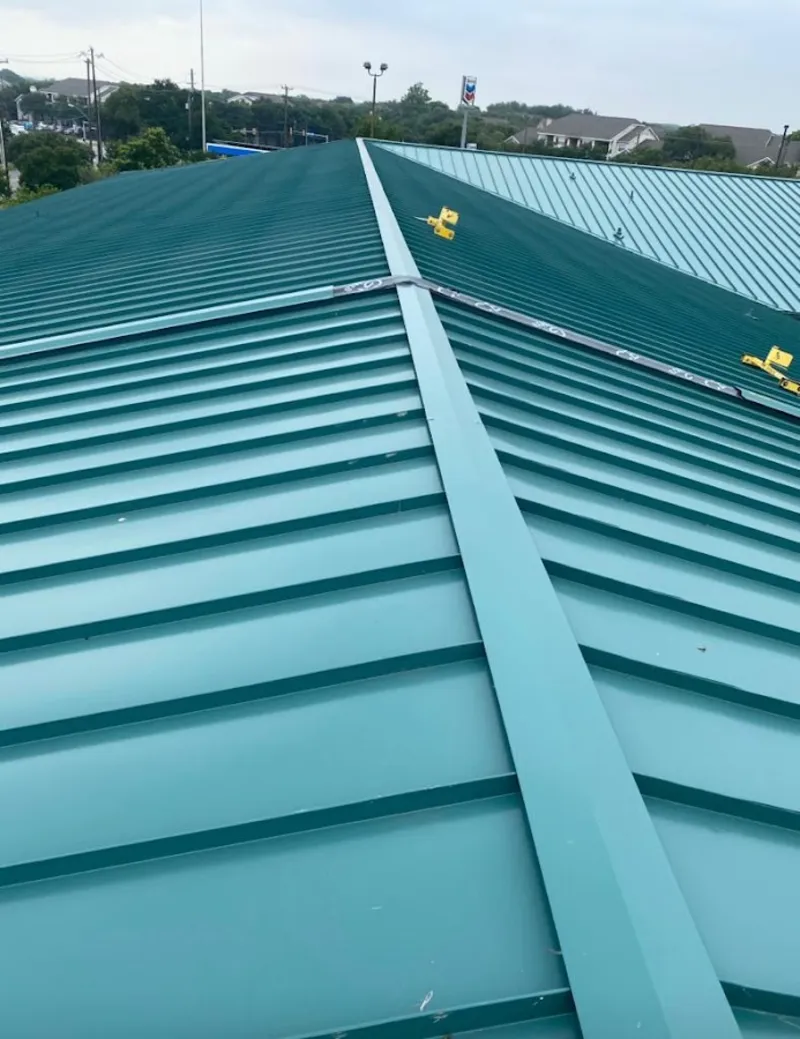 Green commercial metal roof ridge and valley for Metal Roof Repair in Allouez